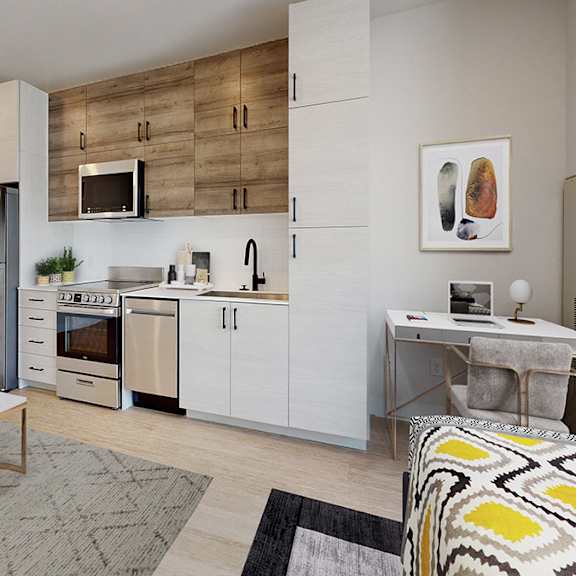 a modern kitchen with white cabinets and a wooden backsplash.
