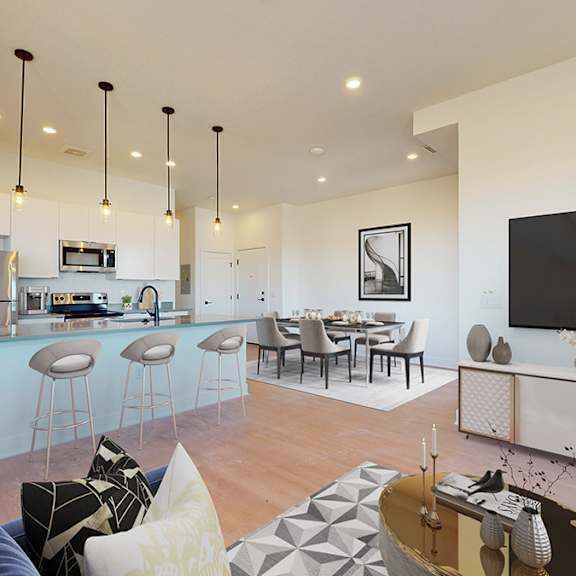 a modern living room with a bar area and a television.