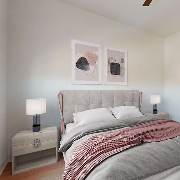 a bedroom with a large bed and two lamps.