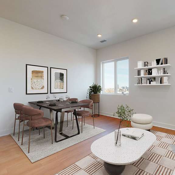 a living room with a dining table and chairs.