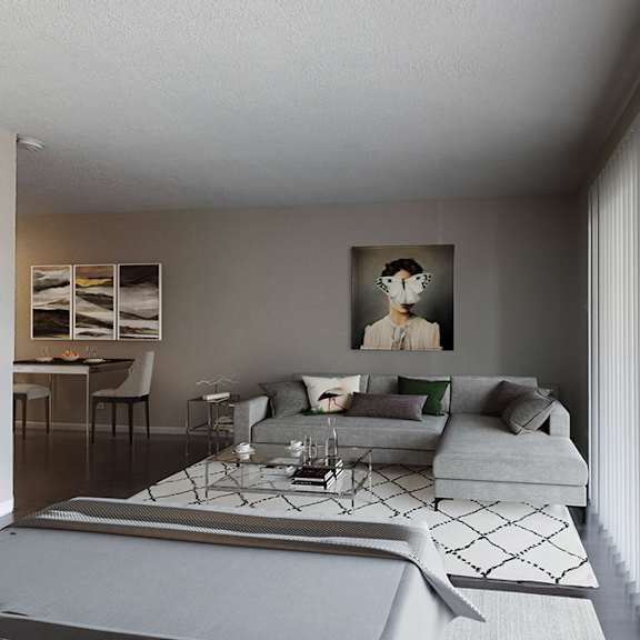 a modern living room with a grey sofa and a coffee table.