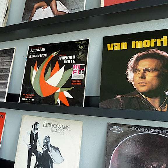 a wall of posters including one for pink floyd.