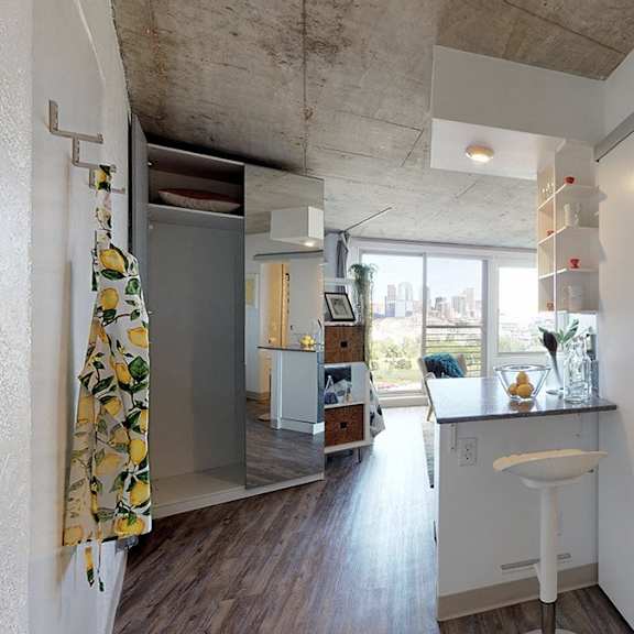 a bathroom with a white sink and a window.