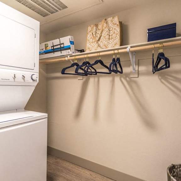 a laundry room with a washing machine and a clothes dryer.