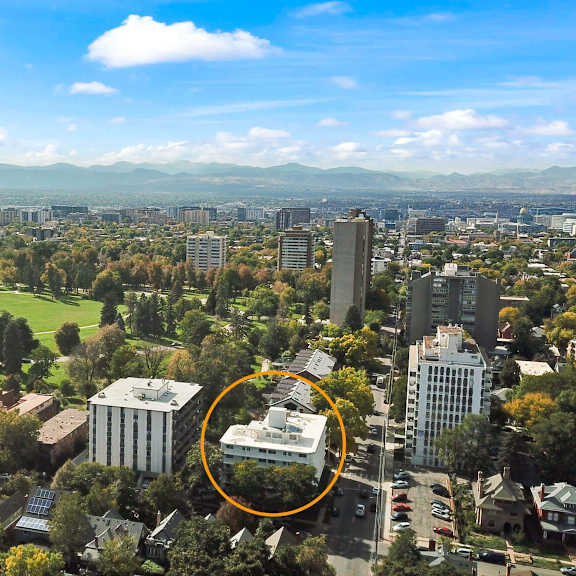 a cityscape with a large building circled in the middle.