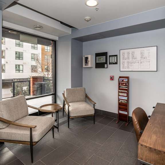 a waiting room with two chairs and a table.