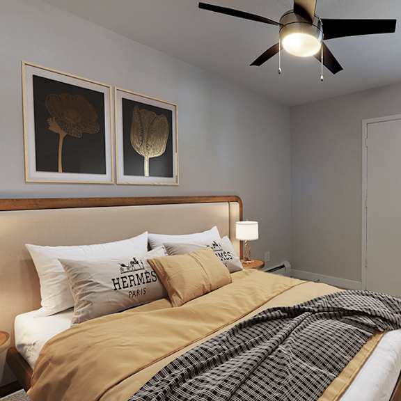 a bedroom with a bed, a ceiling fan, and a window.