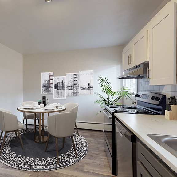 a kitchen with a table and chairs in the middle of the room.