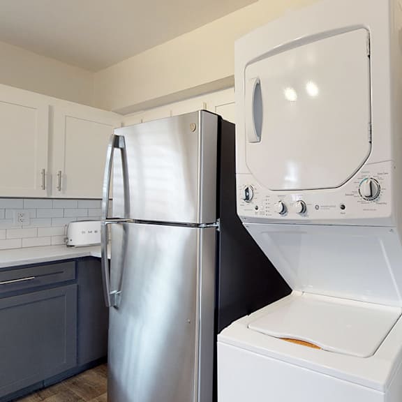 a white oven and refrigerator in a kitchen.
