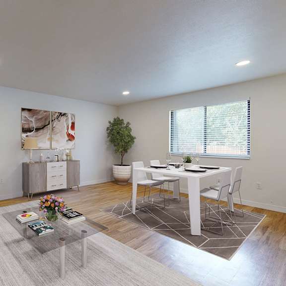 a living room with a grey couch and a coffee table.