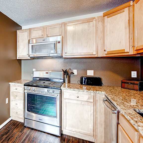 a kitchen with a stove and oven in it.