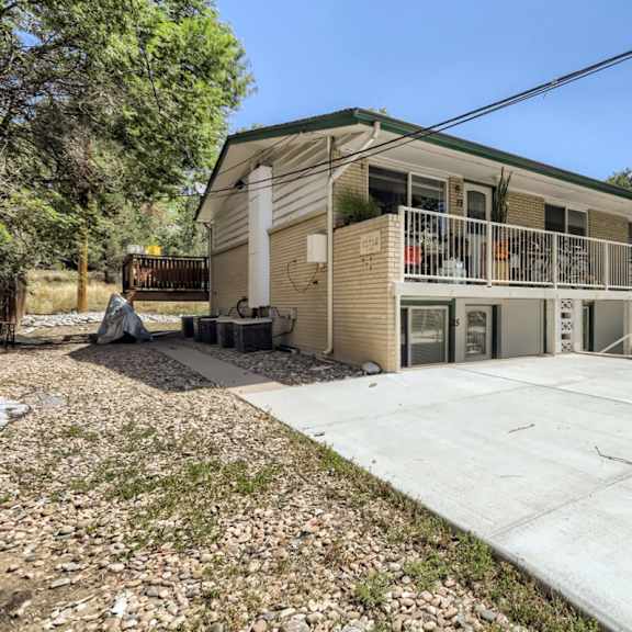 a building with a concrete walkway in front of it.
