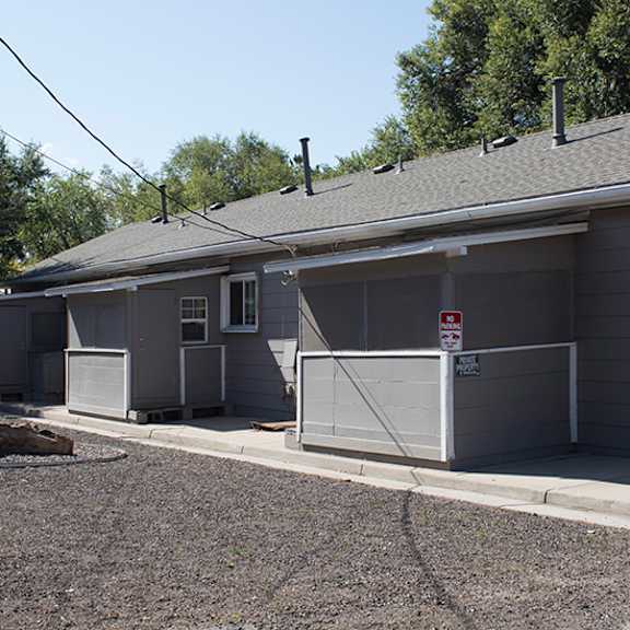 a house with a gray roof and a gray garage door.