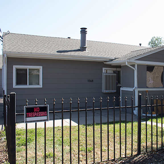 a house with a no trespassing sign in front of it.