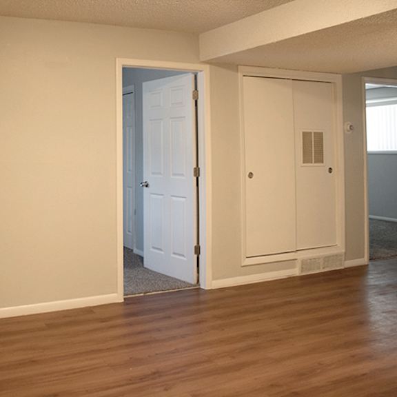 a room with a white door and a white wall.