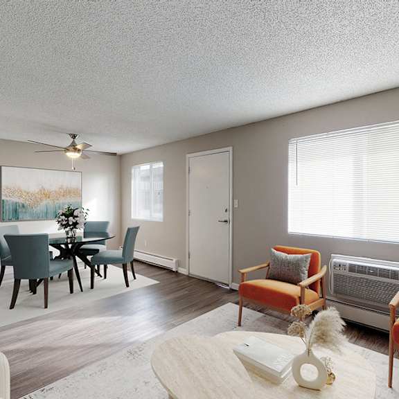 a living room with a dining table and chairs.
