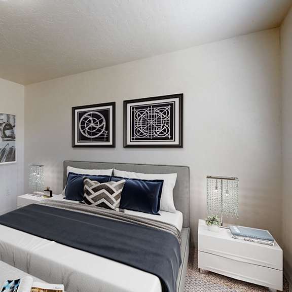 a bedroom with a bed, nightstand, and two pictures on the wall.