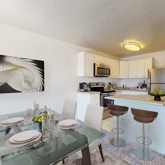 a modern kitchen with a glass dining table set for two.