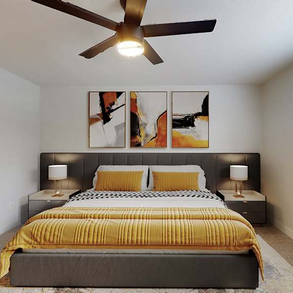 a bedroom with a bed, two lamps, and a ceiling fan.