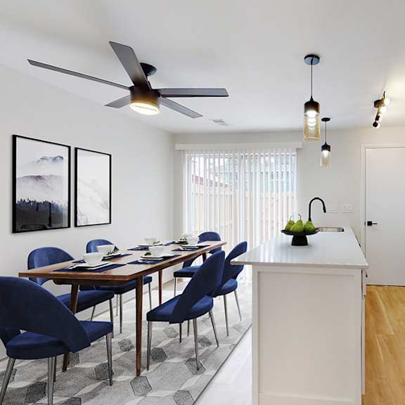 a modern kitchen with a dining table and chairs.