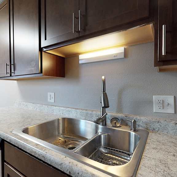a kitchen with a sink and a dishwasher.