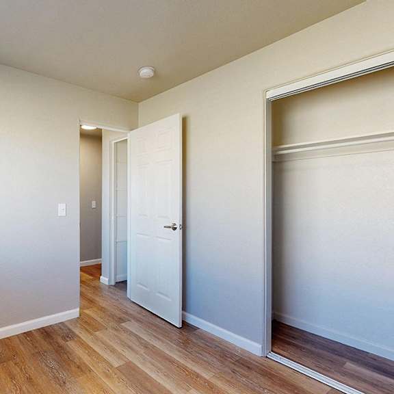a room with a white door and a white wall.