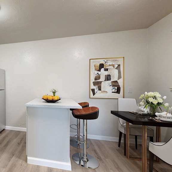 a kitchen with black appliances and white cabinets.