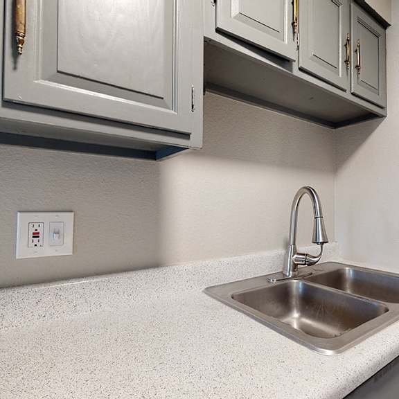 a kitchen with a sink and a light switch.