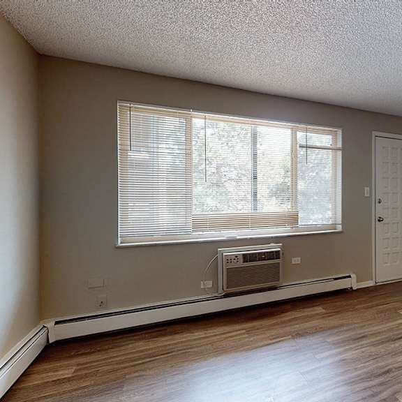 a room with a window and a door is shown.