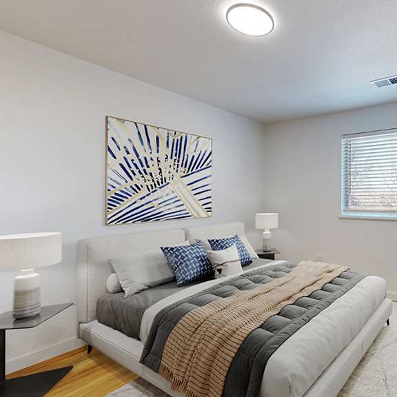 a bedroom with a large bed and a painting on the wall.
