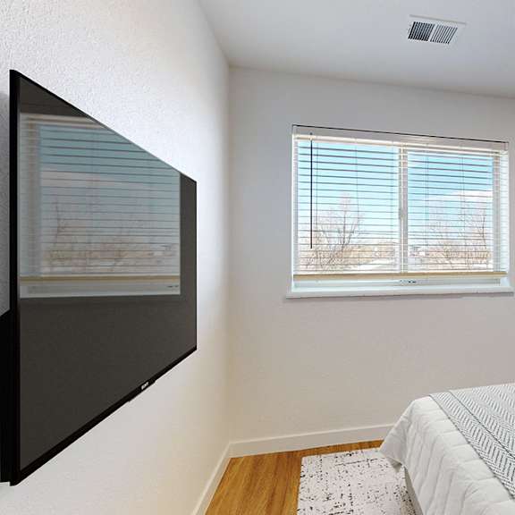 a bedroom with a large bed and a painting on the wall.