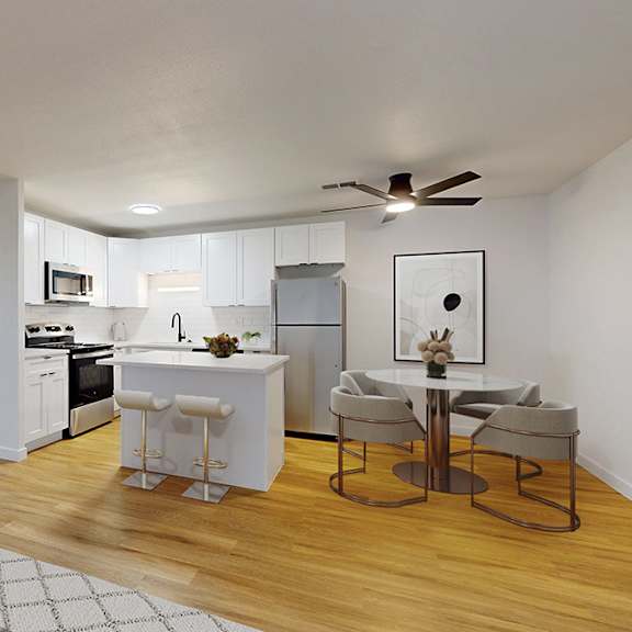 a modern kitchen with a dining table and chairs.