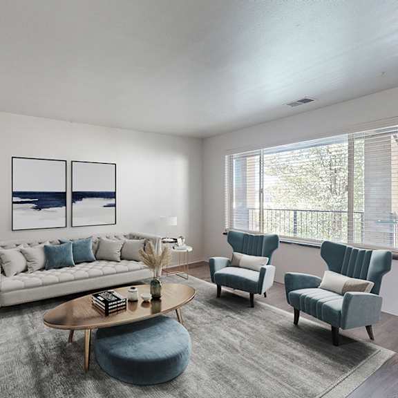 villa parada living room with a grey sofa, a white side table, a black television, a grey rug, and a window with blinds.