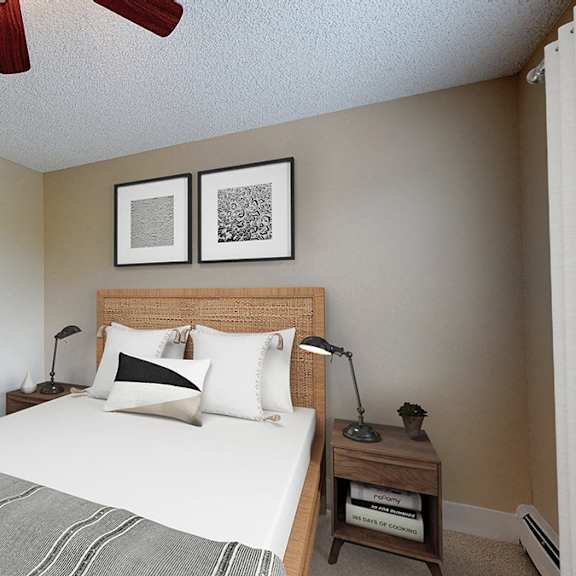 a bedroom with a bed, two nightstands, and a ceiling fan.
