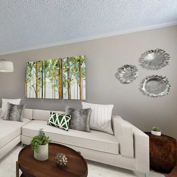 a living room with a white couch, a coffee table, and a large window with curtains.