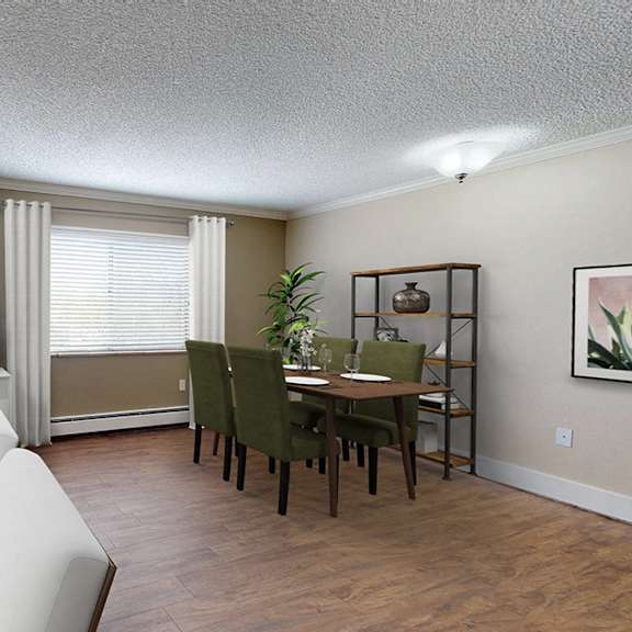 a living room with a white couch and a television.