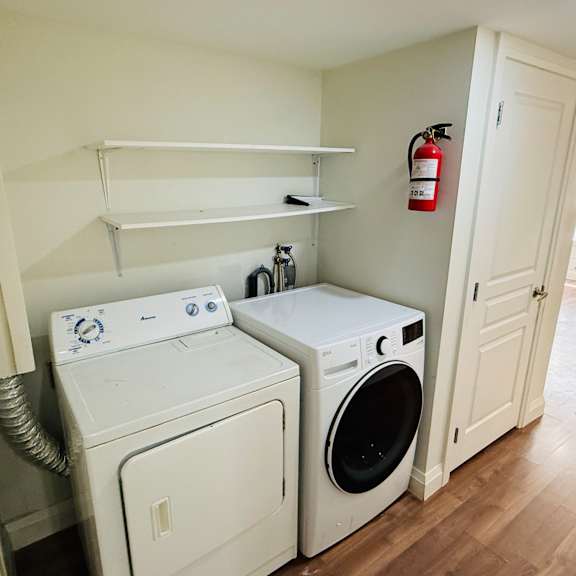 a laundry room with a washer and dryer.