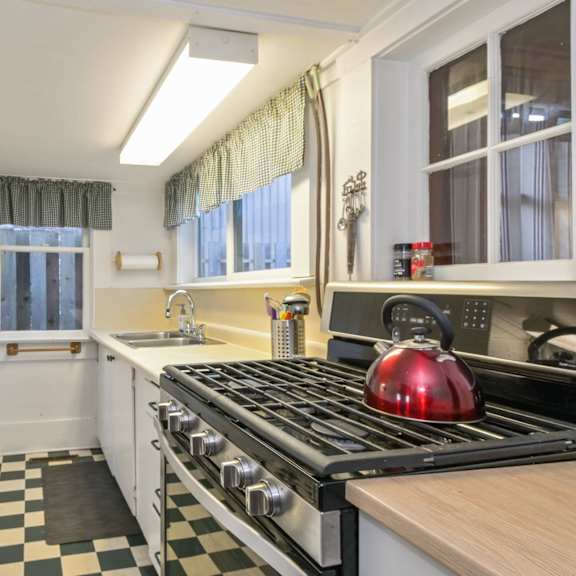 a black and white checkered floor in a kitchen.