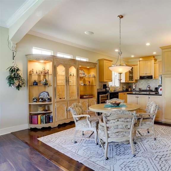 a kitchen with a table and chairs in the middle of the room.