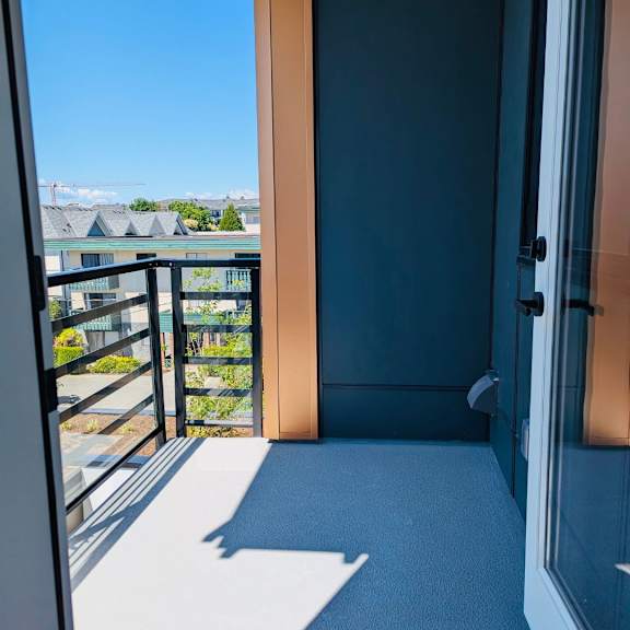 a balcony with a view of a residential area.