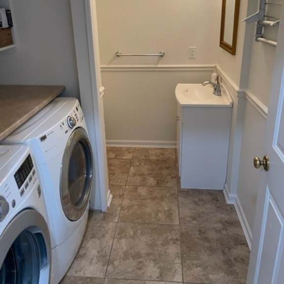 a small bathroom with a washer and dryer in it.