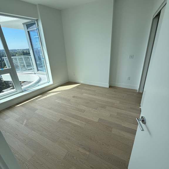 a modern interior with a skylight and wooden paneling.