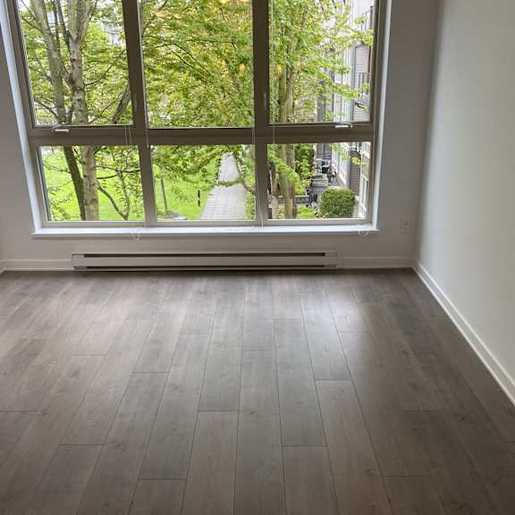 a room with a large window overlooking a street.