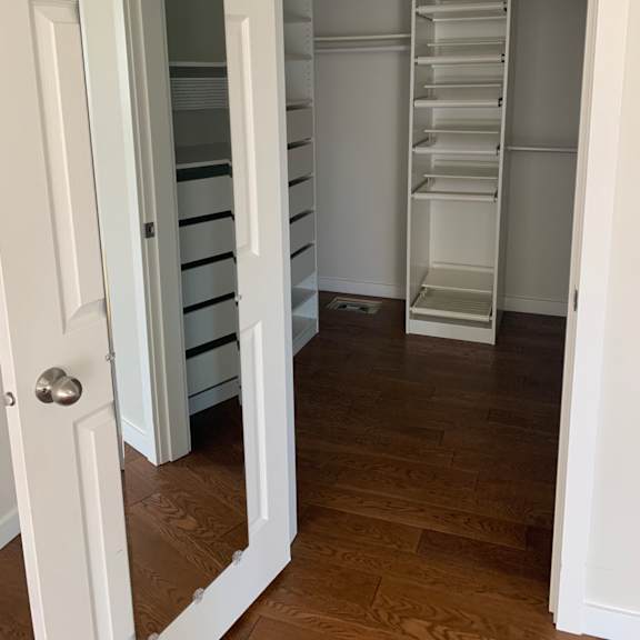 a white drawer with a pull-out tray is open.