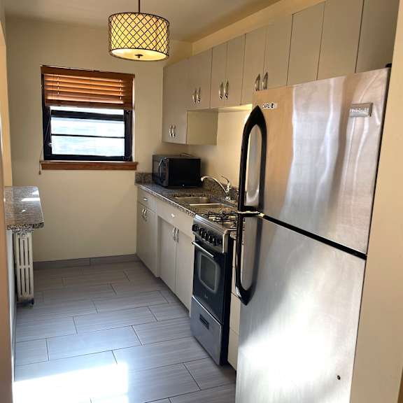 updated kitchen with granite countertops.