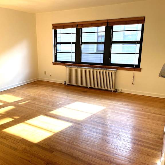 spacious, sunny living room.  hardwood floors throughout.