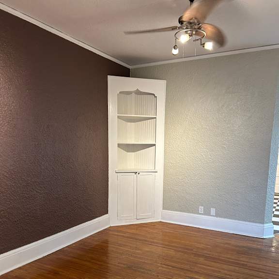 a room with a brown wall and a white door.