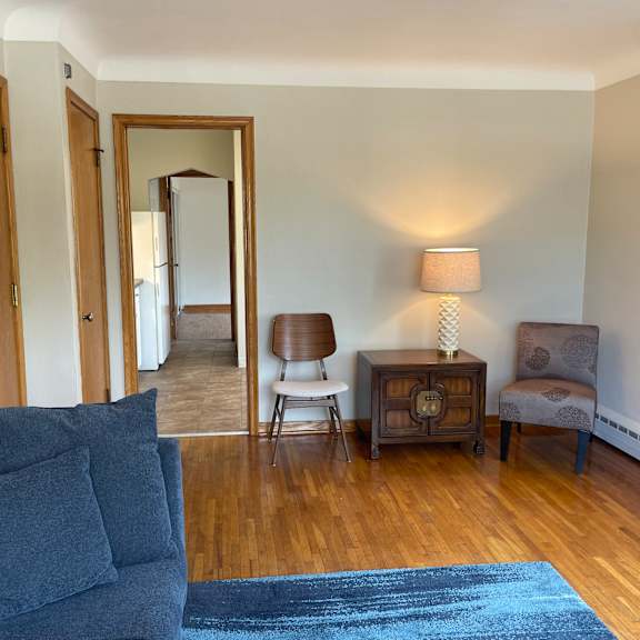 original hardwood floors and coved ceilings.