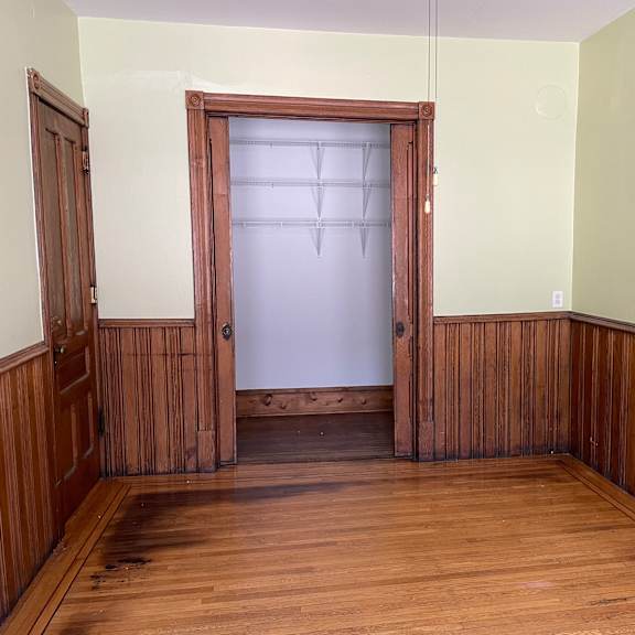 original hardwood floors and oak wainscoting.
