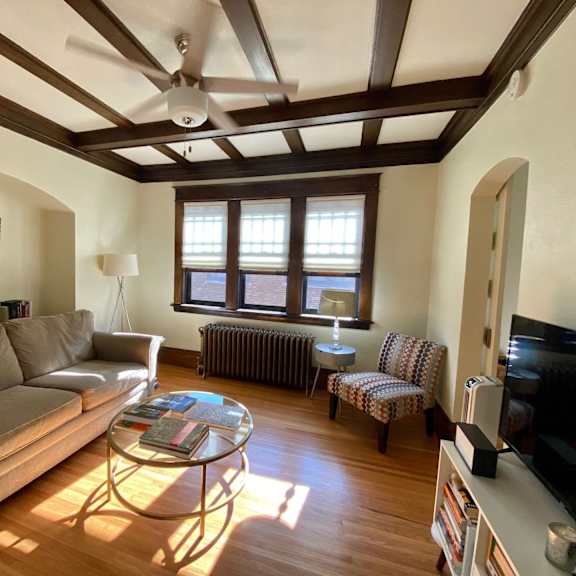a living room with a couch, chair, and coffee table.